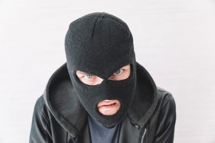 A,Thief,In,A,Black,Jacket.,A,Man,In,A